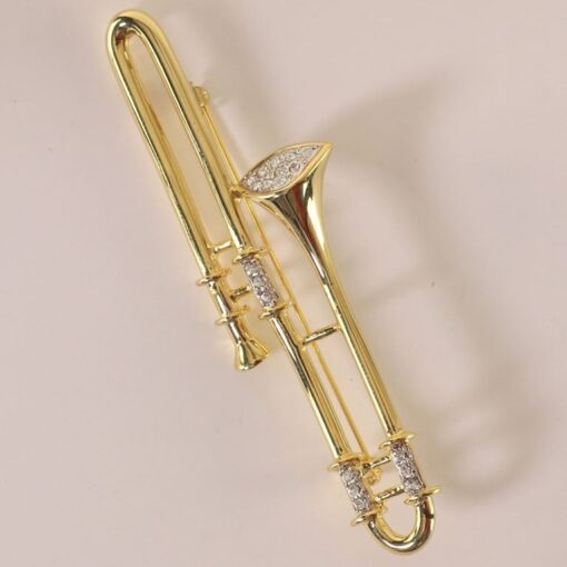 Broche: Trombone 90 Gl + Strass